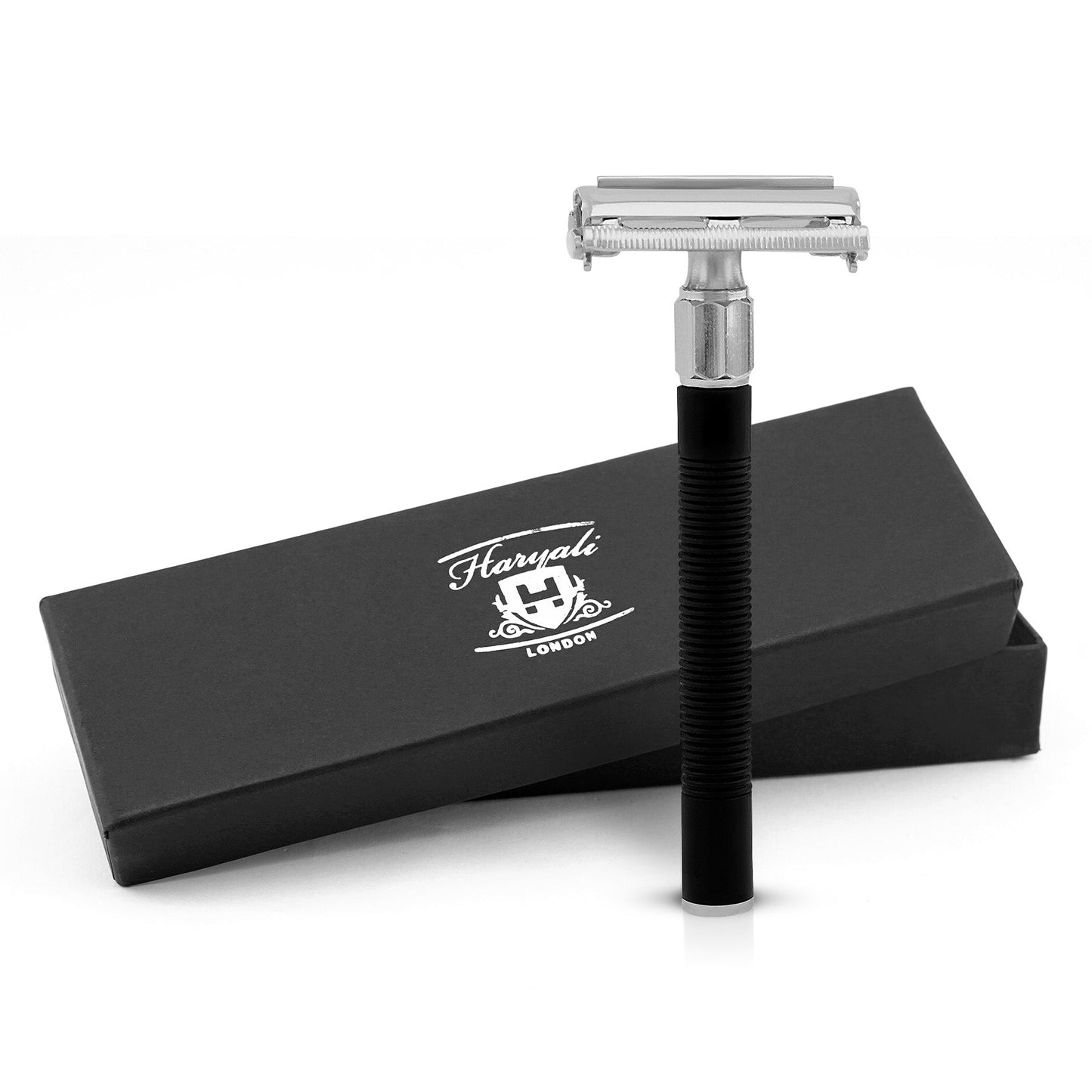 A black Haryali Butterfly Safety Razor with a closed comb, displayed alongside its black box packaging with the brand name 'Haryali London' on it.