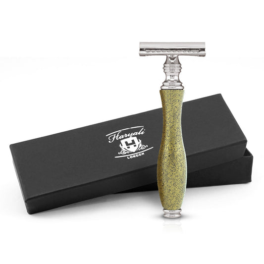 A metallic gold double edge safety razor with a branded black box packaging.