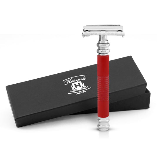 Red safety razor with silver blade and black box featuring 'Haryali London' logo on a white background